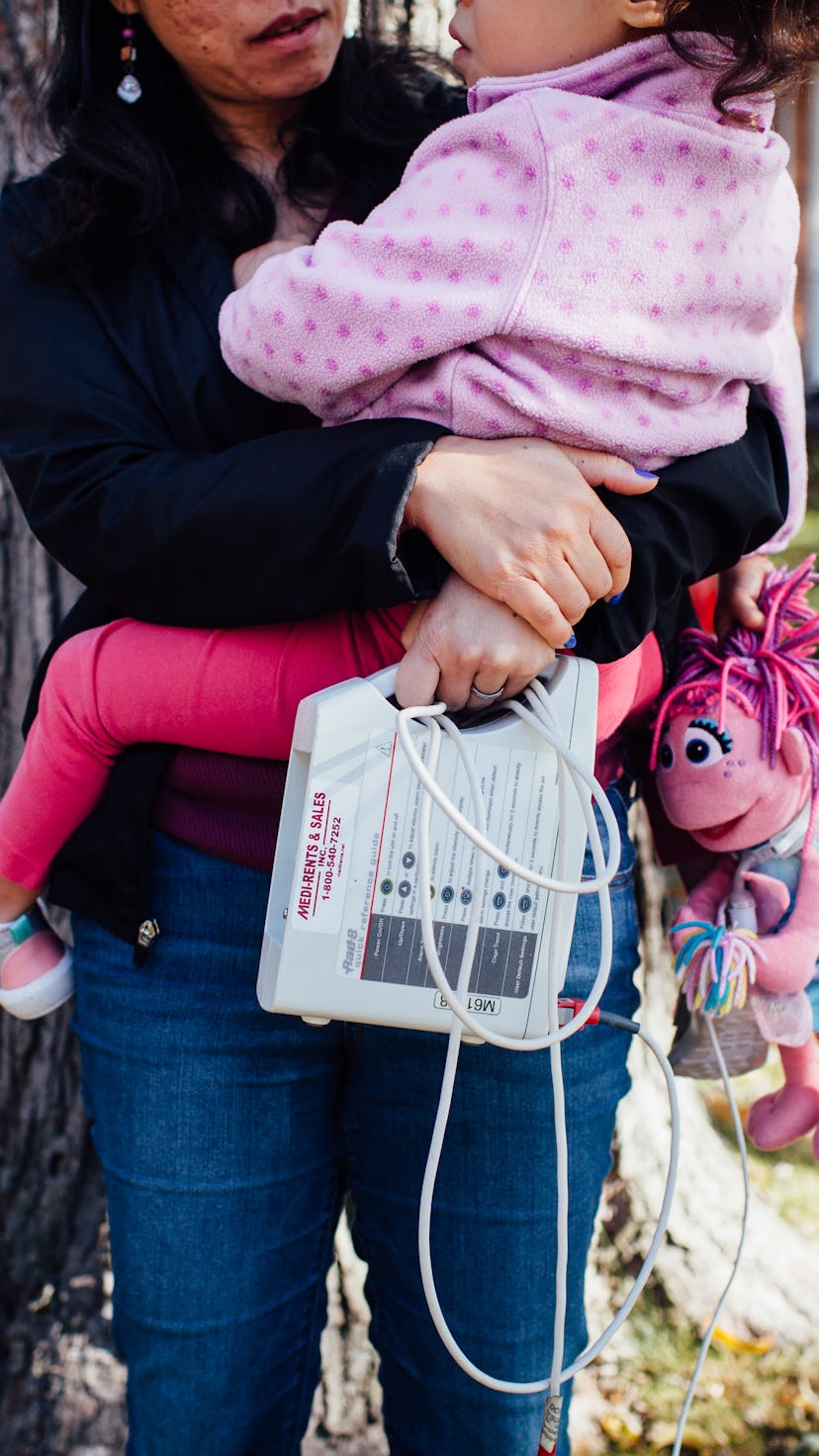 A mother with PTSD holding her daughter