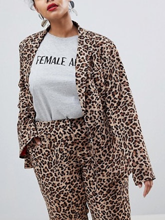 Emma Roberts bundles up in elaborate cheetah print coat with blush fur trim