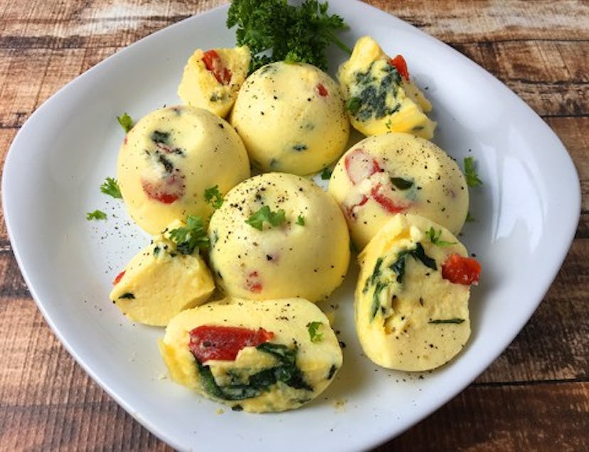 plate of egg bites with tomato and spinach