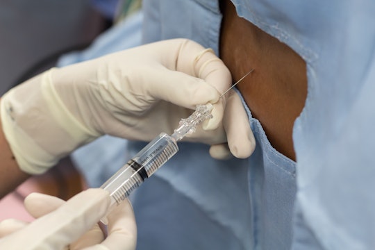 A woman getting an epidural injection