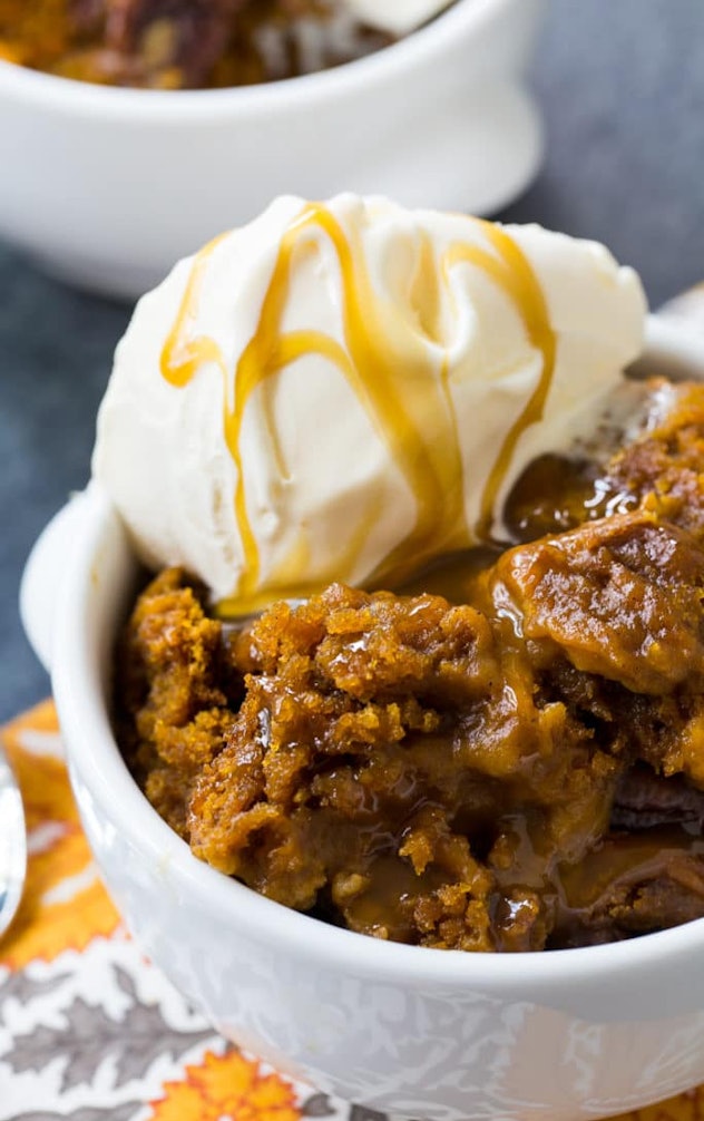 Thanksgiving Desserts: Caramel covered deconstructed pumpkin cake with ice cream on top in a bowl wi...