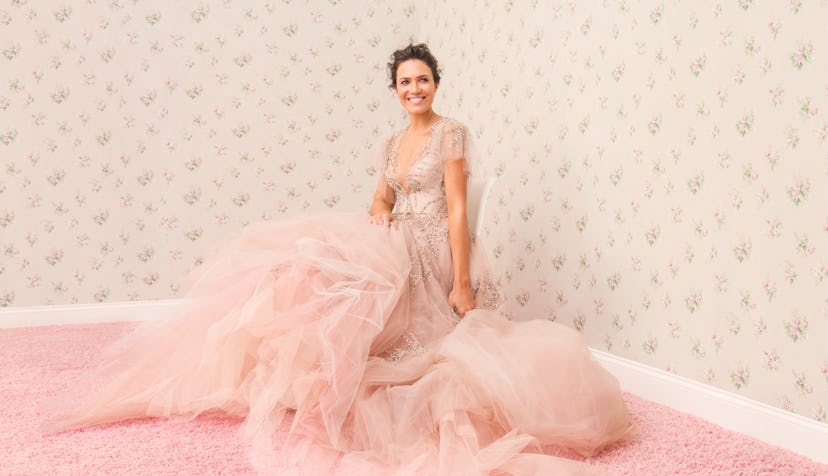 Mandy Moore sitting in a pink gown