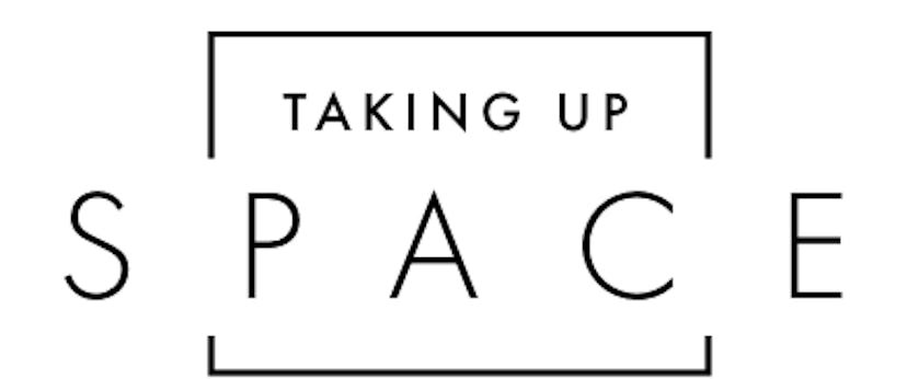 "Taking up space" black text on a white background