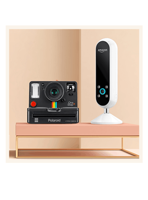 A black Polaroid OneStep+ camera and a white Amazon Echo smart speaker