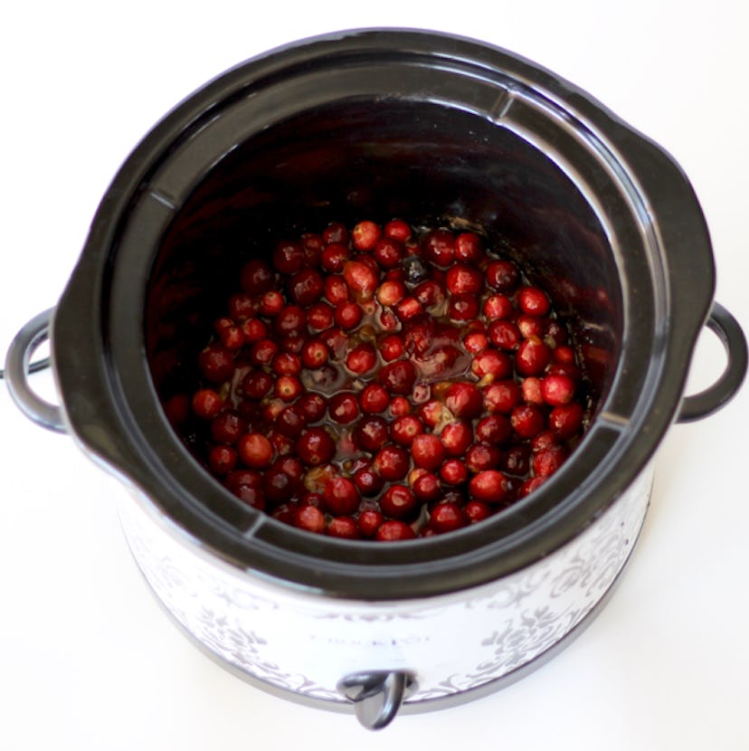 crock pot full of vibrant red cranberries