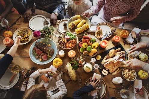 Top-down photo of a table covered in Thanksgiving dishes.