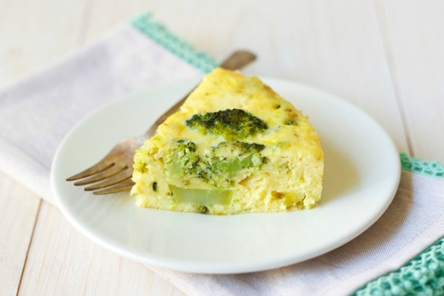 slice of bacon broccoli frittata on a white plate