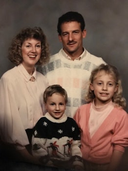 Old family photo of two parents and kids 