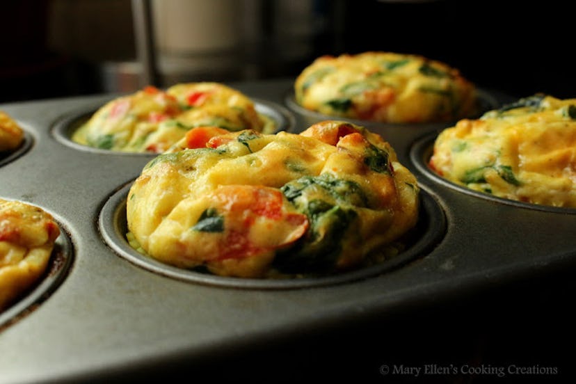 muffin pan with omelette mixture cooked into egg muffin