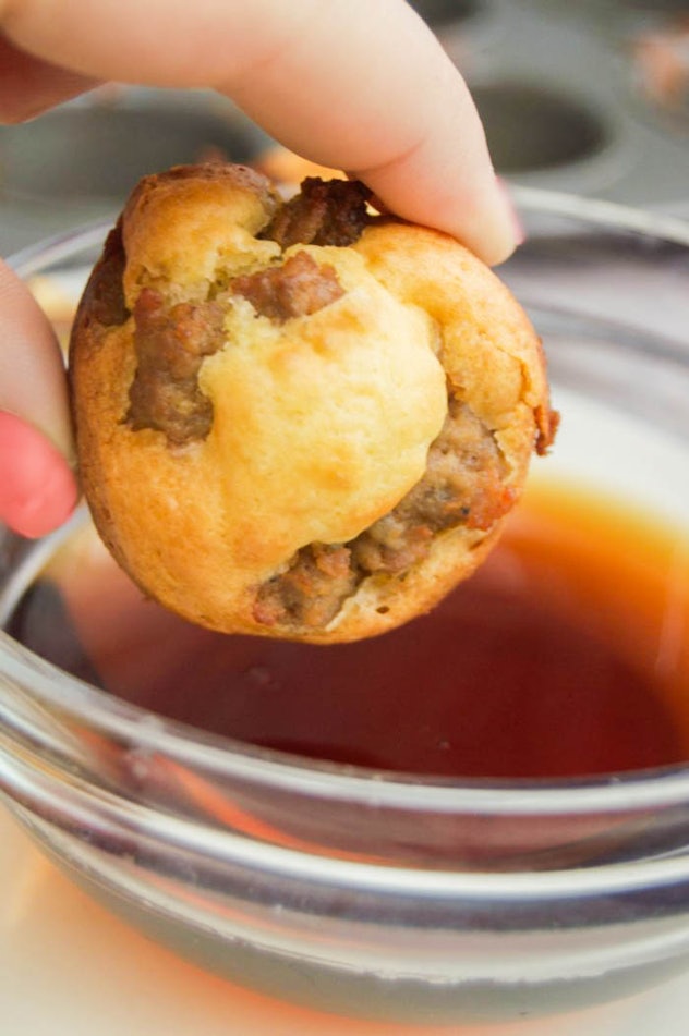 close up of mini muffin with pieces of sausage in it