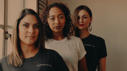 Three young women posing together for a photo