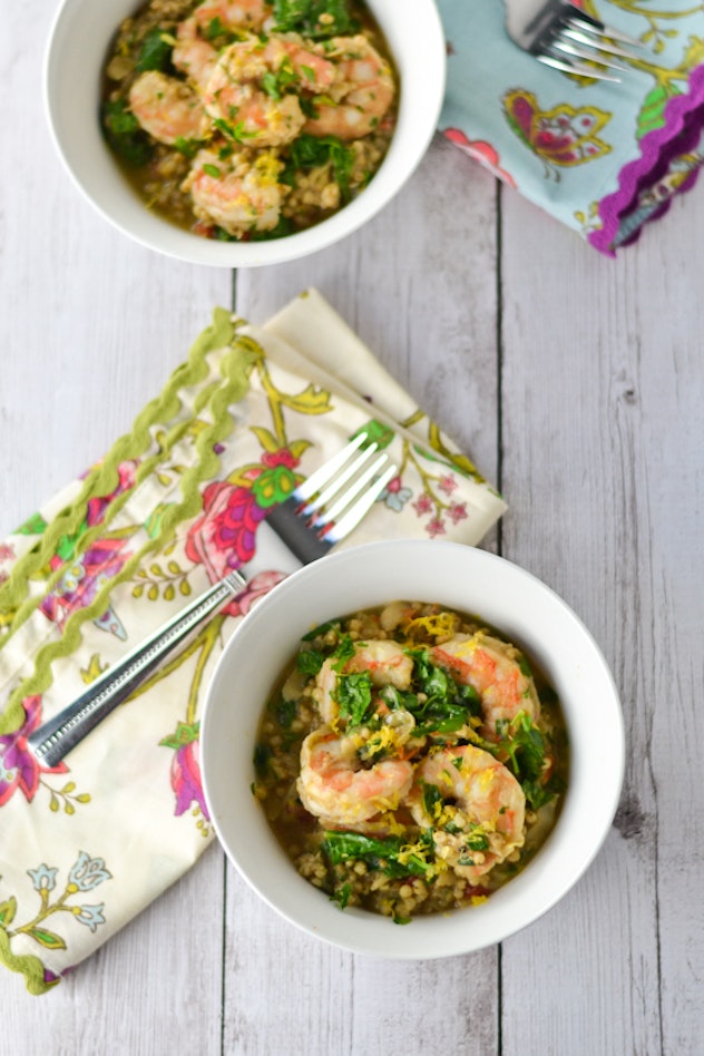 Two bowls of shrimp risotto on a wooden table