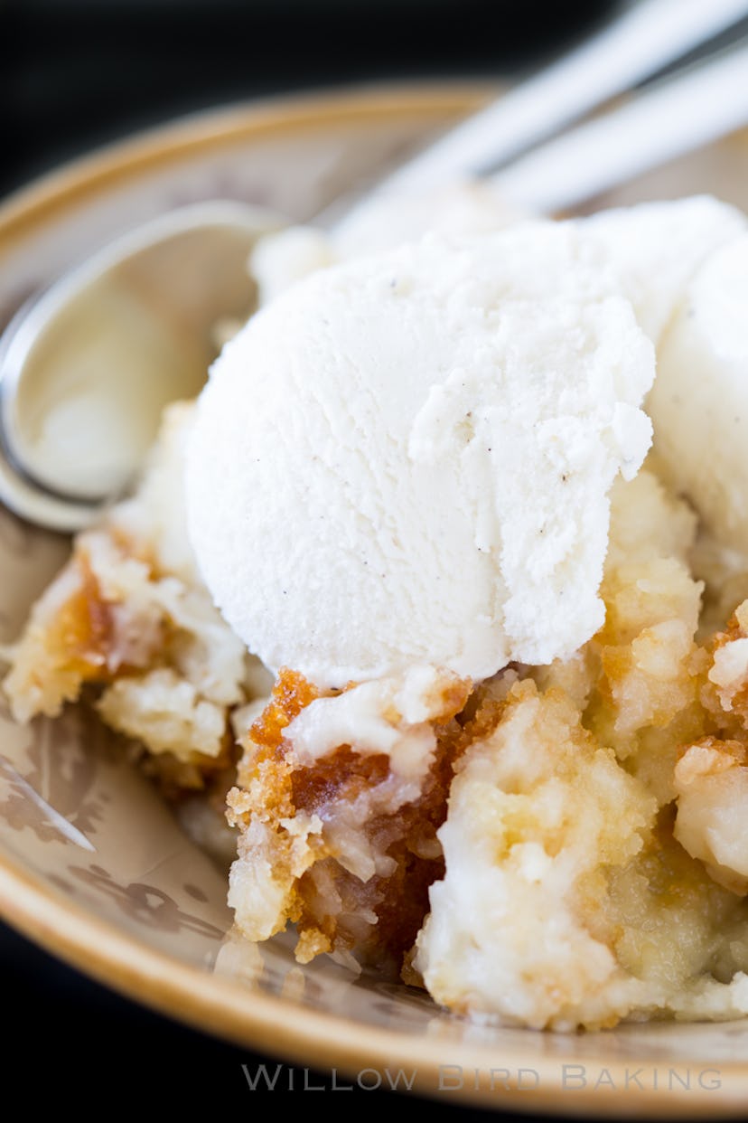 Slow cooker full of coconut cake with ice cream on top