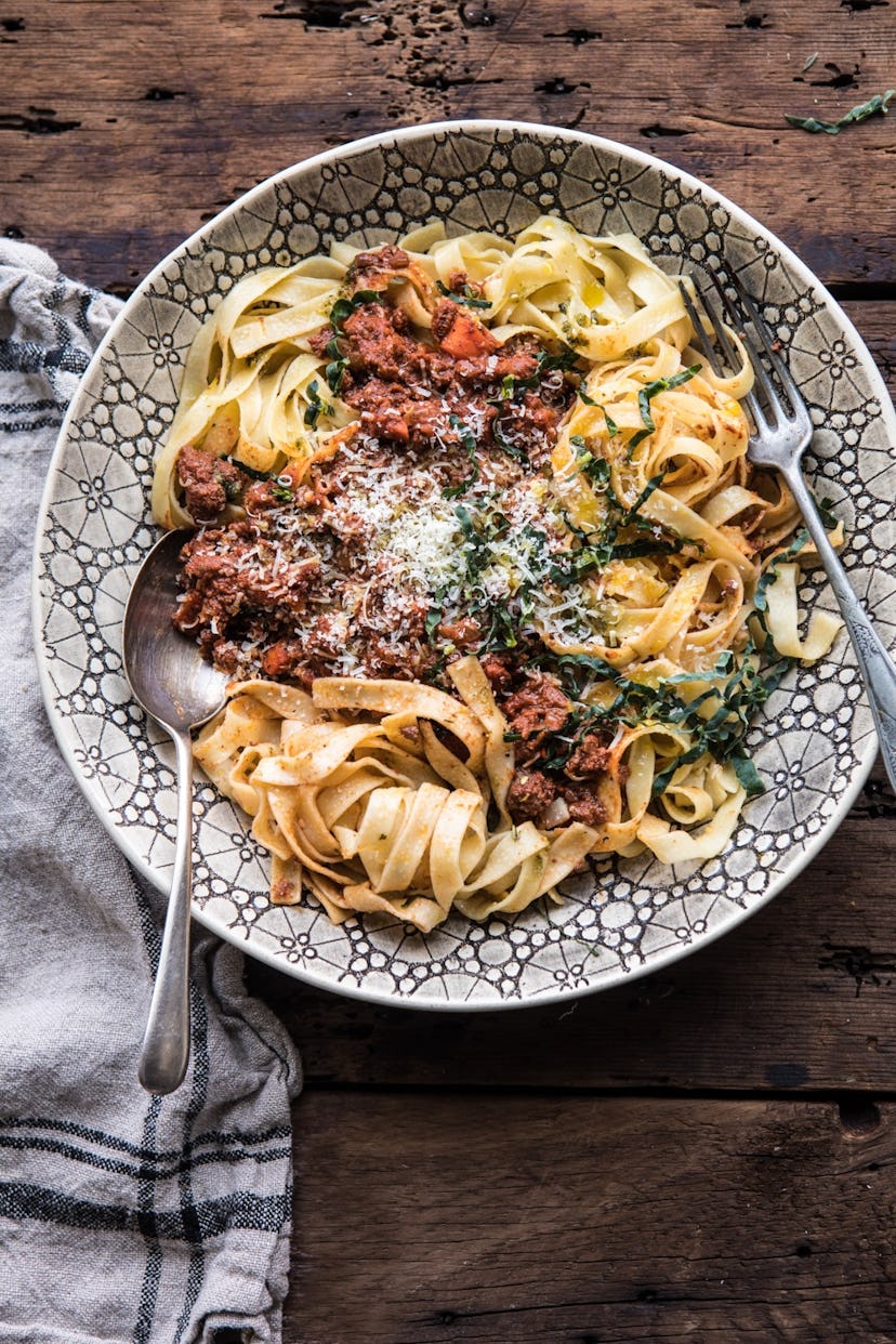 Pasta with a meat sauce on top on a plate