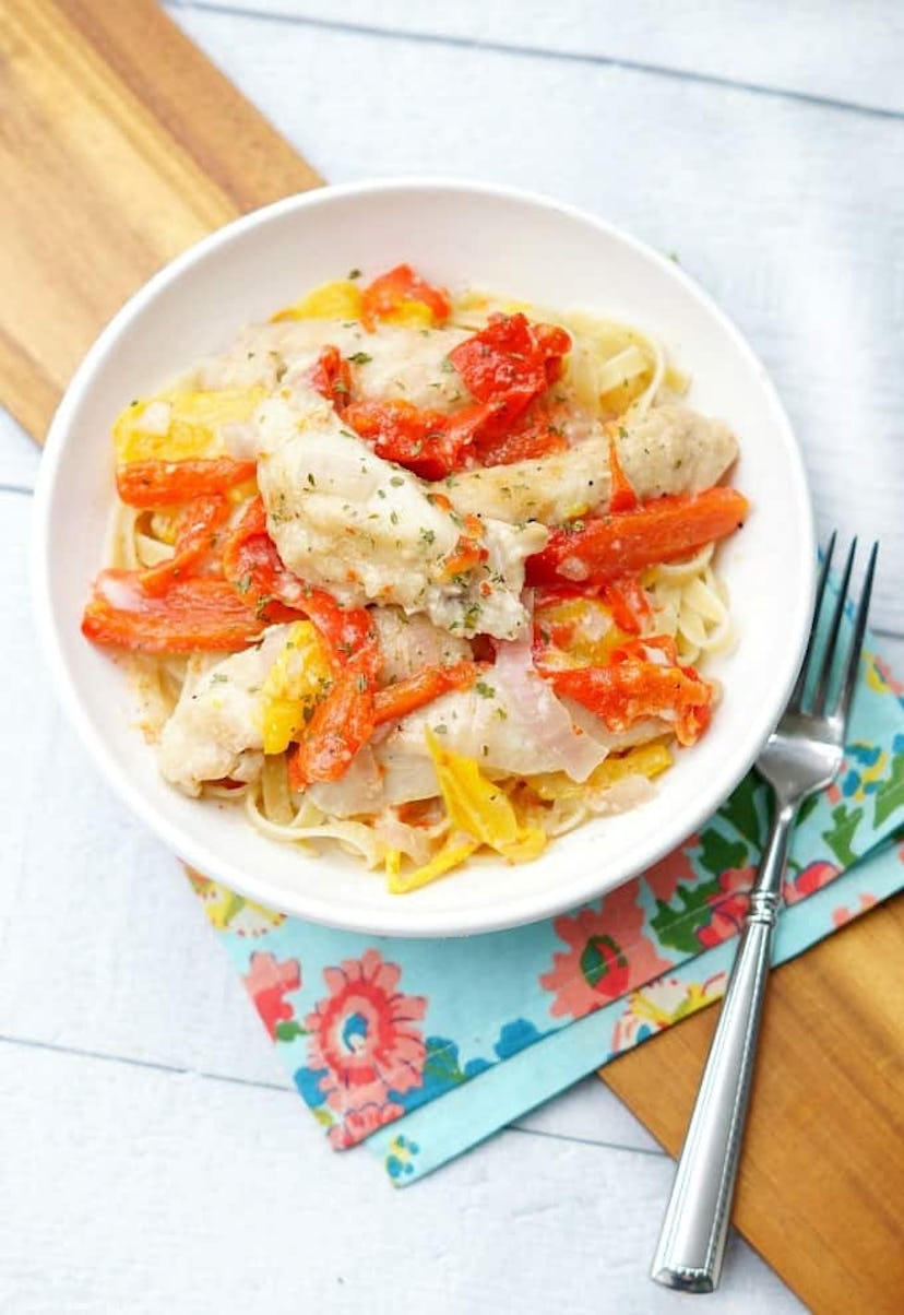 pasta covered with chicken scampi and cooked bell peppers