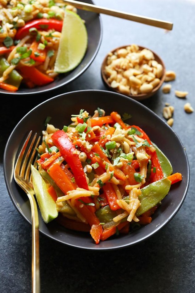 pad thai in a bowl with chopsticks