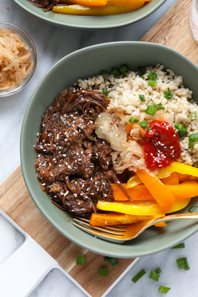 bowl with shredded beef, carrots onions and rice