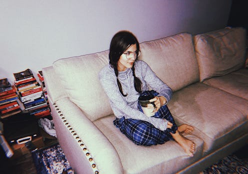 A disabled girl sitting tired on a couch