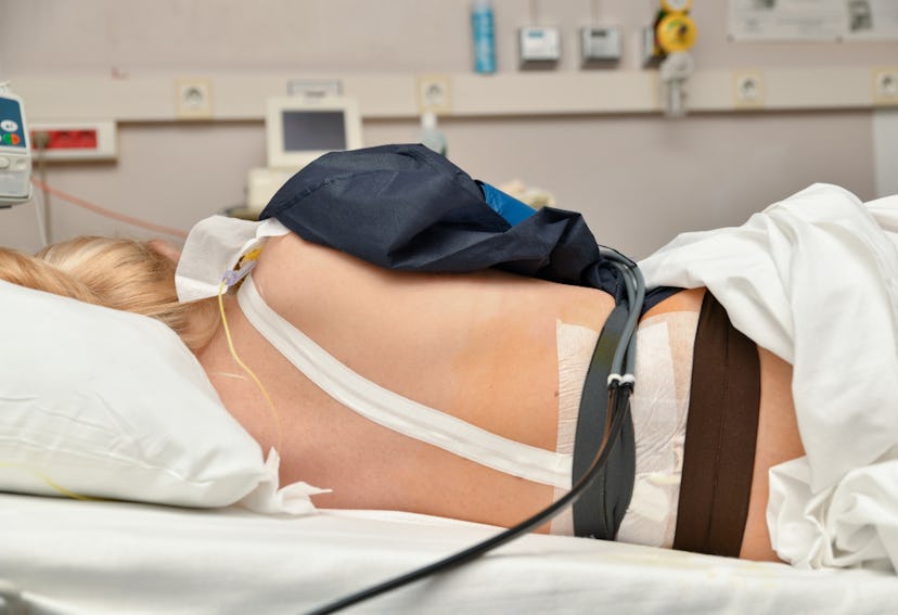 Woman laying on her side and sleeping through labor