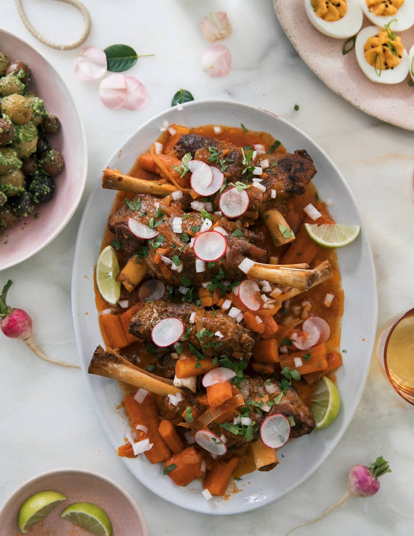 aerial view of lamb shank layered with radishes and carrots