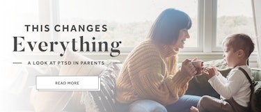 Mom holding her tea and spending time with her son, posing for a Romper's "A look at PTSP in parents...