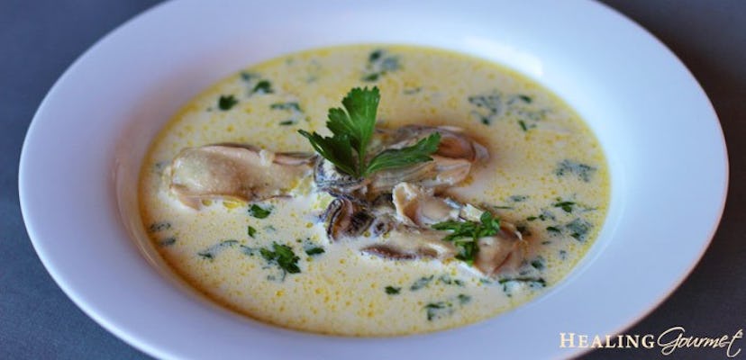 bowl of light yellow creamy soup with oysters