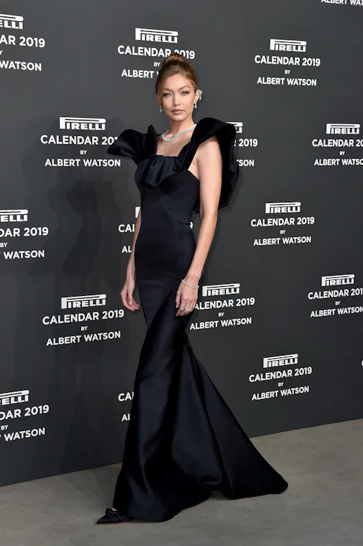 Gigi Hadid's Black Dress At The 2018 Pirelli Calendar Launch Was Pure Glamour Gigi Hadid's Black Dress At The 2018 Pirelli Calendar Launch Was Pure Glamour