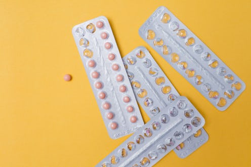 four packs of birth control pills, three of them are empty
