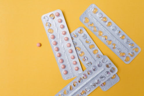 four packs of birth control pills, three of them are empty