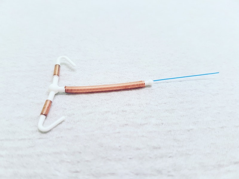 A brown and white IUD