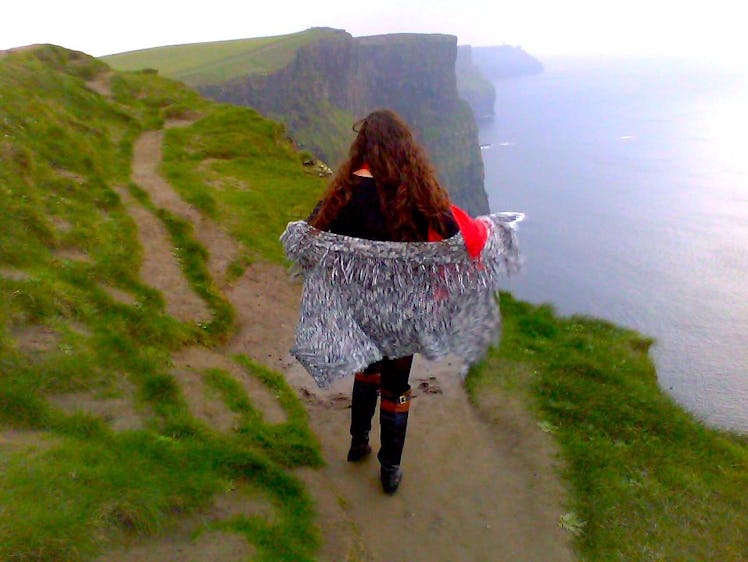 Kaitlyn walking down the pathway of Cliffs of Moher.