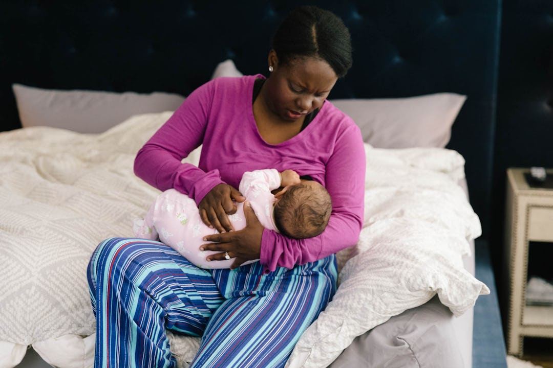 Why Do Babies Vomit After Breastfeeding? It's Not The Same As Spitting Up