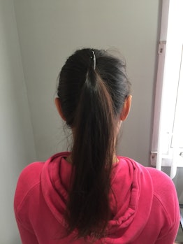 Yasmine Singh with a messy ponytail made with banana clip