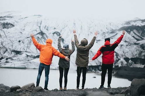 A group of friends celebrating being at a cold mountain side during spring break