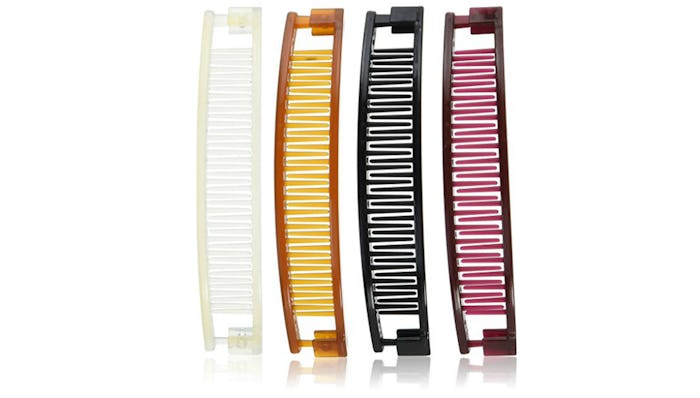 A white, yellow, black, and red '90 banana clip, that are total life-savers for new moms