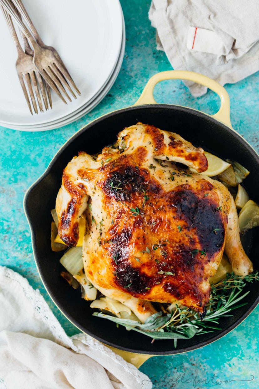 Instant Pot honey butter and herb roasted chicken served at a table 
