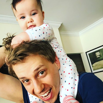 Selfie of the dad and his little baby who is on his shoulders