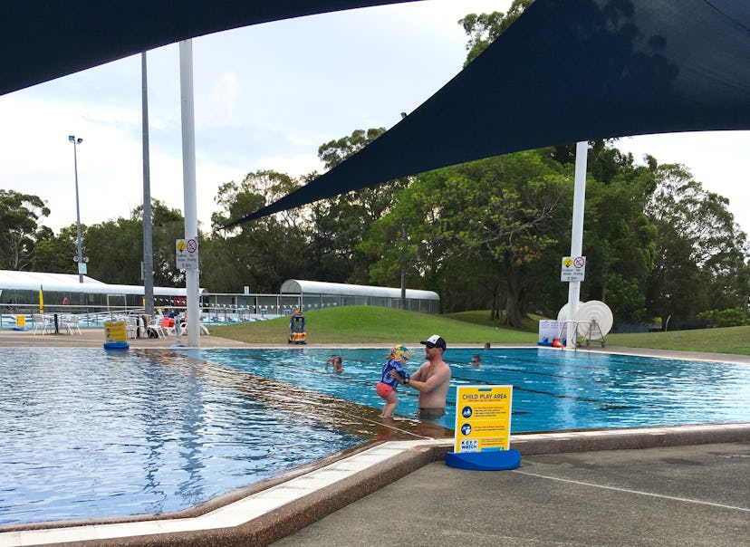 An Australian swimming pool, covered by a shade cloth.