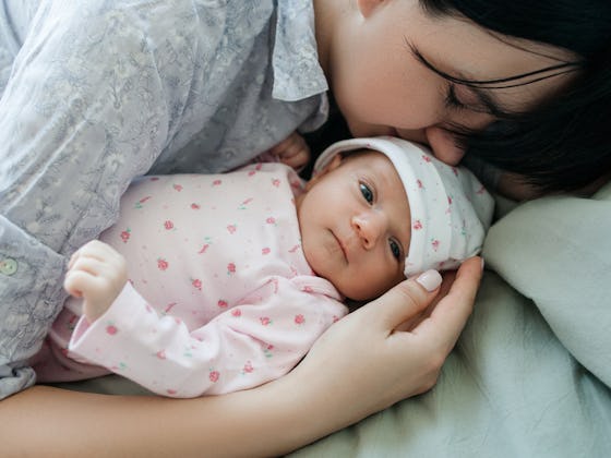 Mom with her newborn baby after her 6-week postpartum checkup