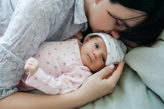 Mom with her newborn baby after her 6-week postpartum checkup