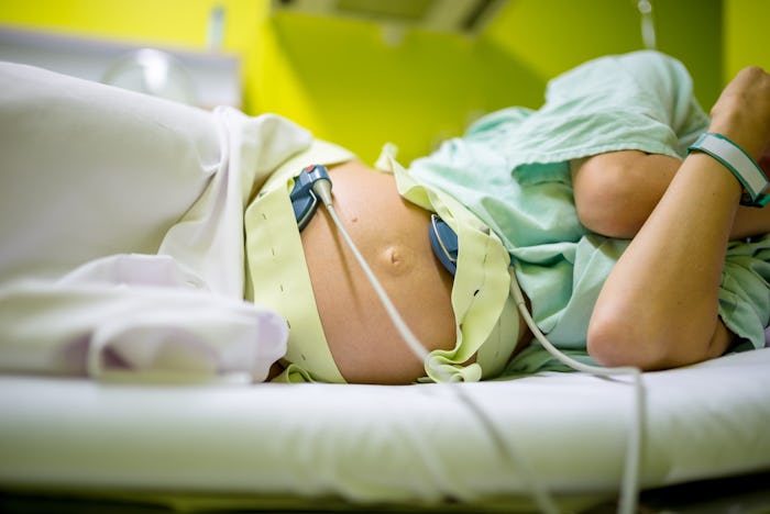 The belly of an introverted woman in labor