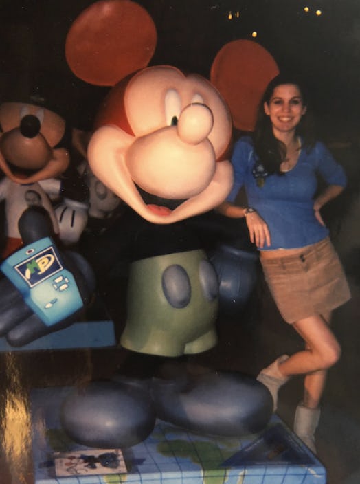Christy Carlson Romano posing next to a Mickey Mouse sculpture