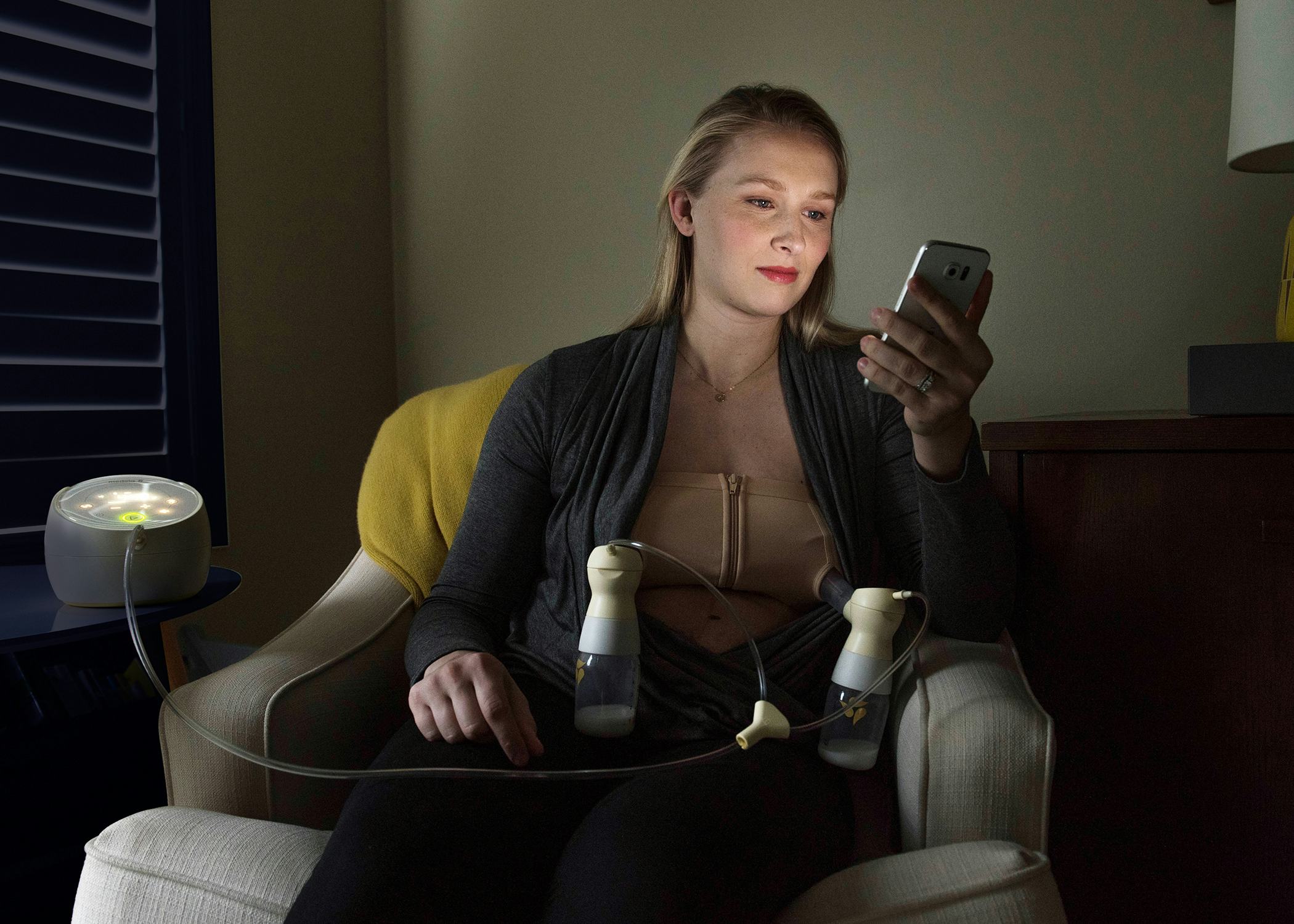 A woman testing the smart breast pump 