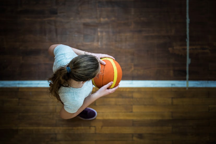 A girl playing basketball
