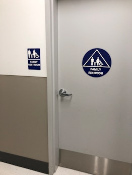 Family restroom sign on a door