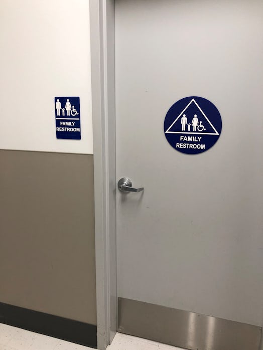Family restroom sign on a door