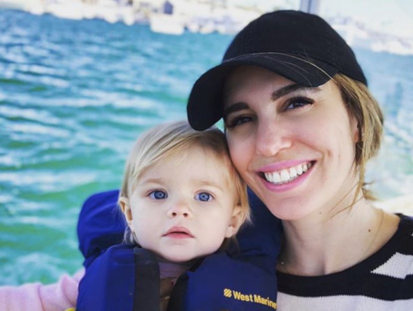 Christy Carlson Romano posing for a photo with daughter Isabella during a boat ride