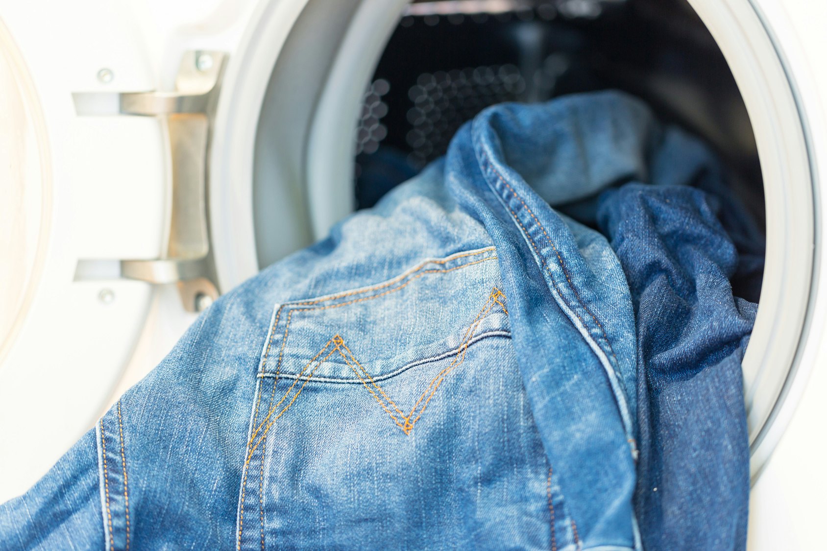 putting jeans in dryer