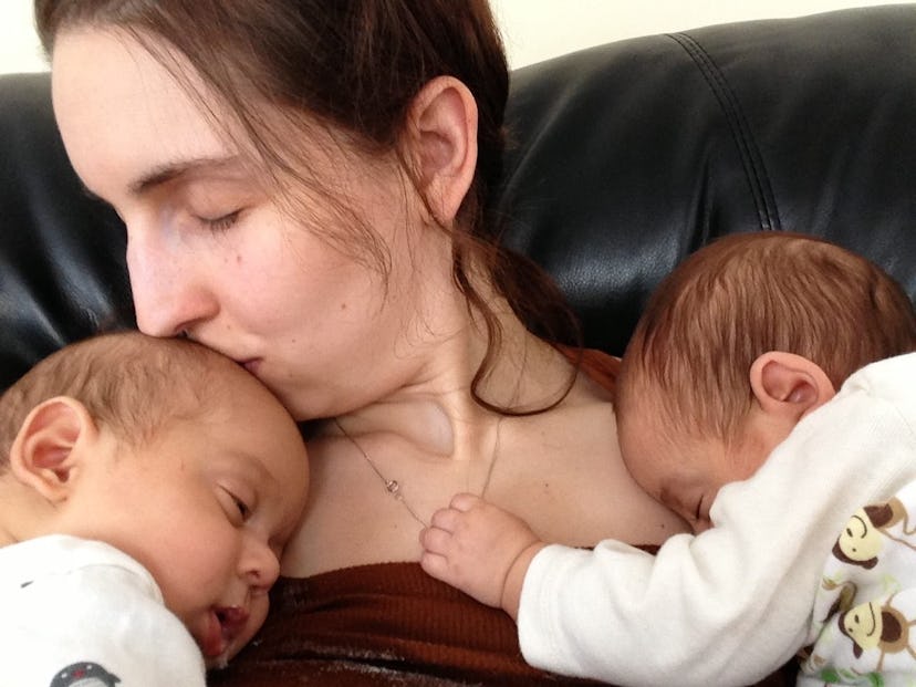 Dr. Brenna Velker with her twins, who are sleeping on her chest