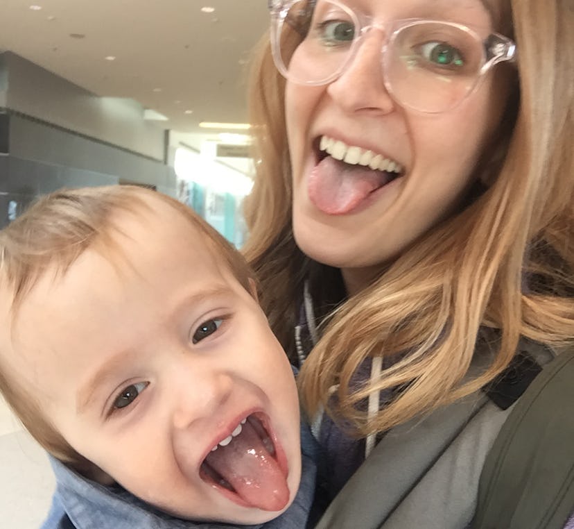A helicopter mom and her son take a selfie with their tongues out